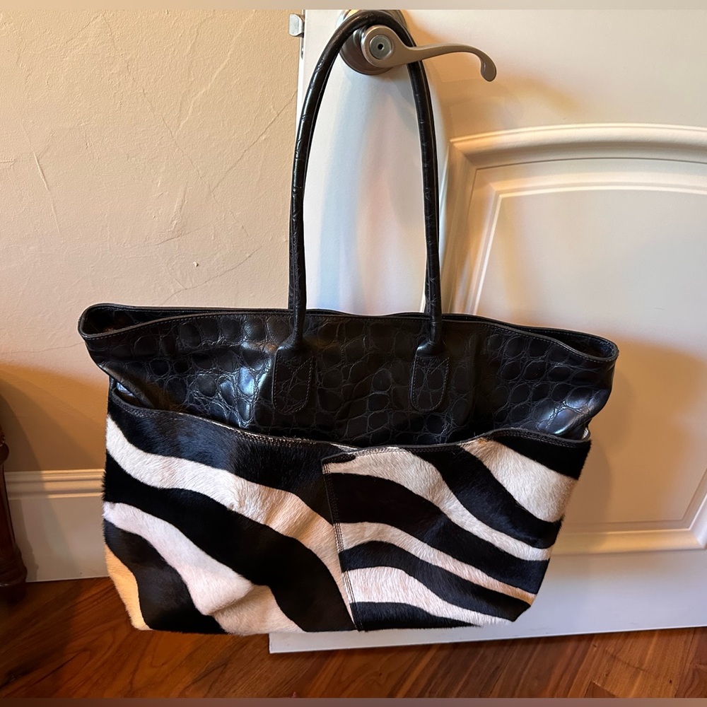 Gorgeous leather and fur tote bag with red interior.